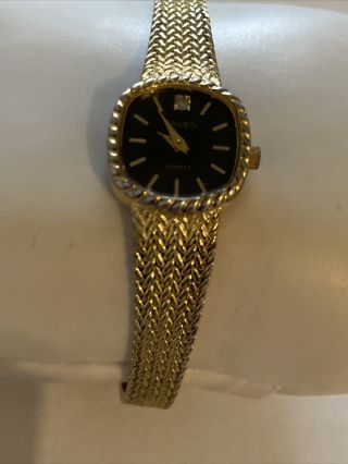 Vintage Gruen Ladies Gold Tone Quartz Analog Black Dial Watch