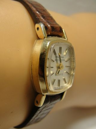 LADIES BULOVA ACCUTRON,  10 K GOLD FILL CASE WITH CROWN 3