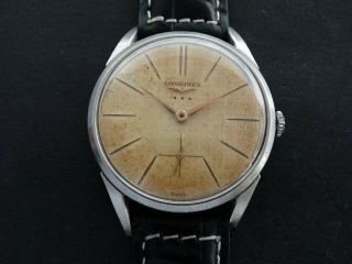 VTGE CLASSIC AND ELEGANT LONGINES 12.  68z TEXTURED DIAL MEN WATCH.  Ref 7111.  1959 4