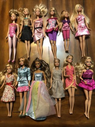“lot Of 12 Barbie Dolls”