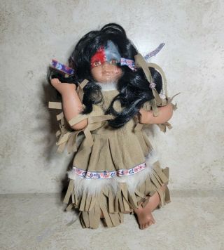 Native American Indian Porcelain Collectible Sitting Doll 9.  5”inches